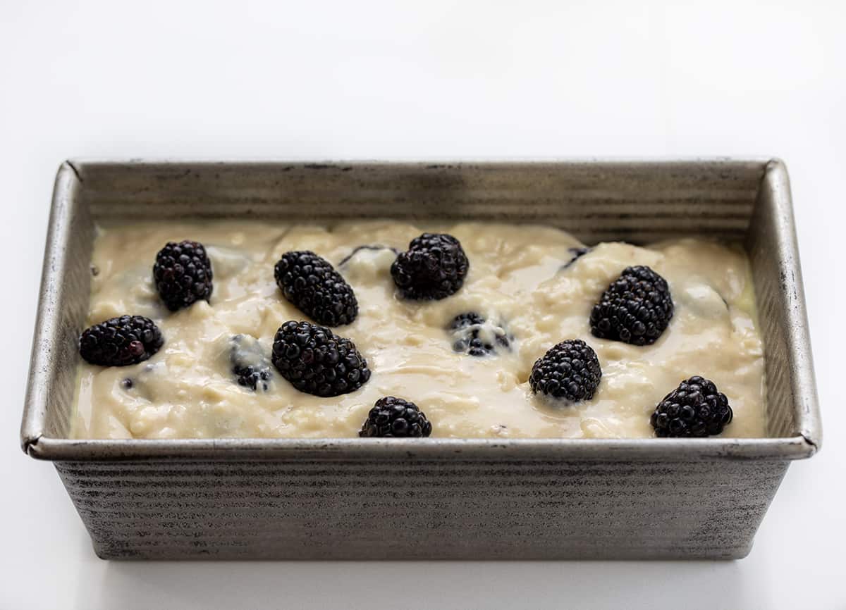 Raw Batter for Blackberry Loaf in a Pan on a White Counter.