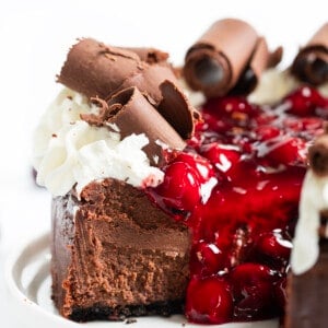 Black Forest Cheesecake with One Piece Removed Showing Inside Texture.