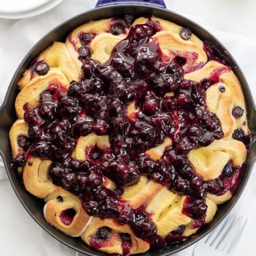 Blueberry Lemon Skillet Rolls in Skillet on a White Counter.