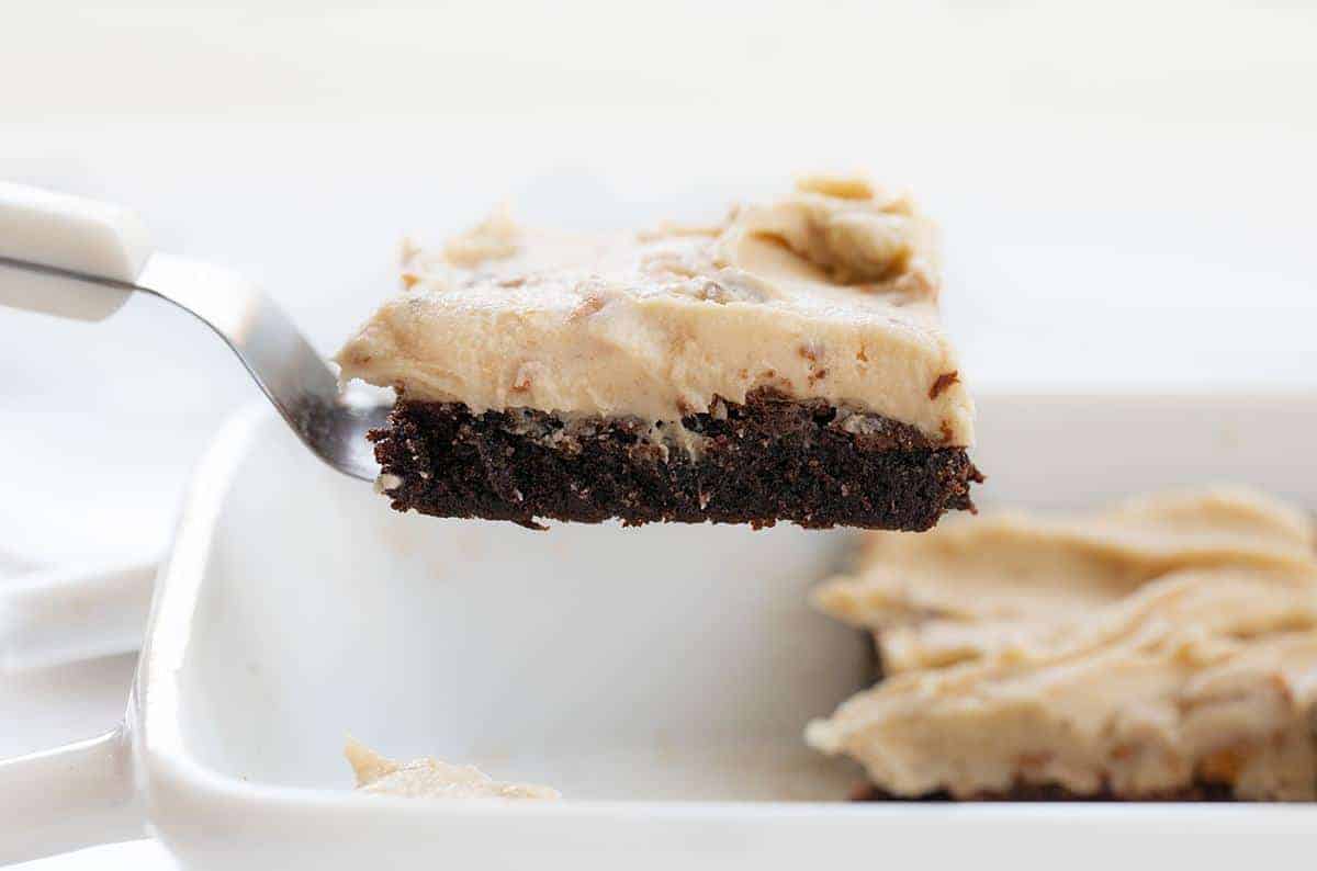 Spatula holding one Brownie with Butterfinger Buttercream