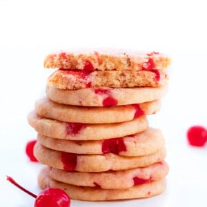 Stack of Cherry Icebox Cookies and Top Cookie Broken in Half Showing Texture Inside. Cookies, Baking, Icebox Cookies, Summer Cookies, Cherry Cookies, Easy Cherry Cookies, How to Make Icebox Cookies, Cherry Almond Cookies, i am baker, iambaker