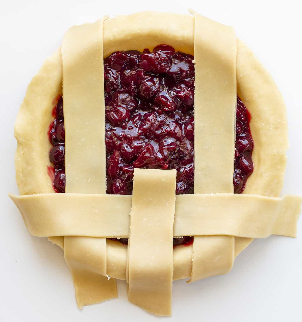 Putting Together a Lattice Crust on a Cherry Pie. Cherry Pie, Homemade Pie, Real Homemade Cherry Pie, How to Make Cherry Pie Filling, Best Homemade Pie Crust, Old Fashioned Cherry Pie, The Best Cherry Pie, Baking, Dessert, Christmas Pie, Thanksgiving Pie, Easy Cherry Pie, i am baker, iambaker