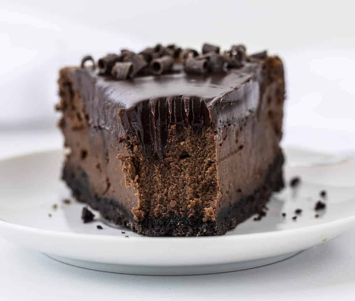 One Slice of Chocolate Cheesecake with the tip removed showing the inside