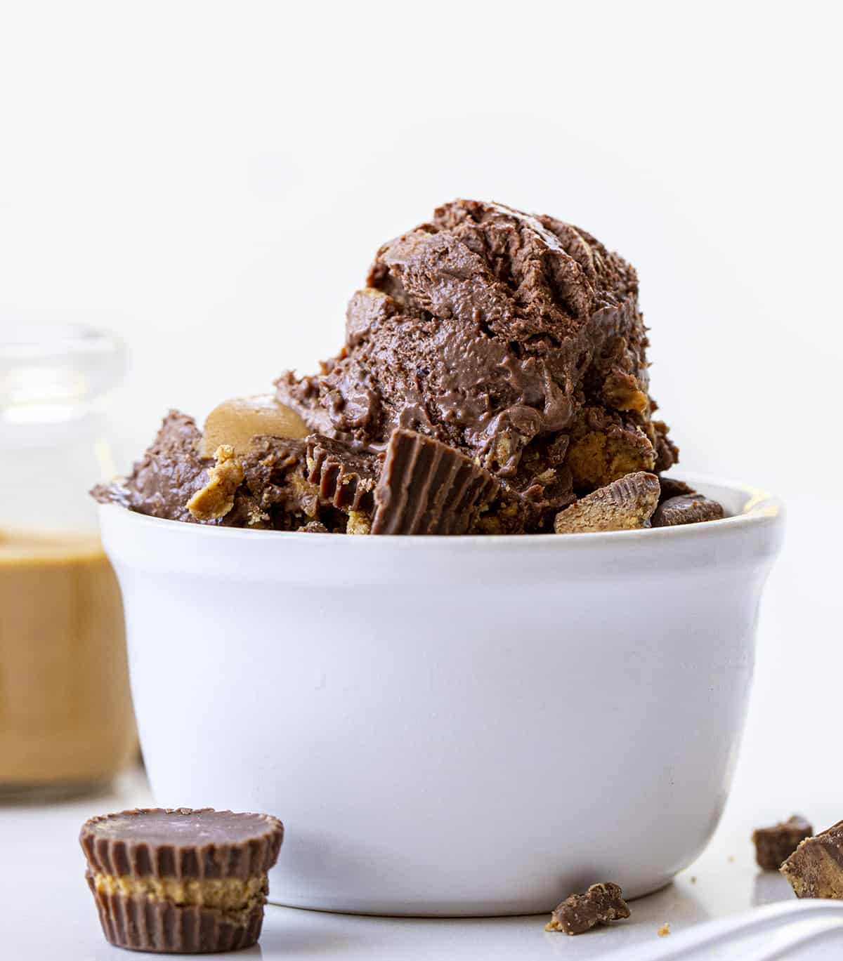 Bowl of Chocolate Peanut Butter ice Cream with Peanut Butter Cups around It. Dessert, Ice Cream, Ice Cream recipes, No Churn Ice Cream Recipes, How to Make Chocolate Ice Cream, Chocolate Peanut Butter ice Cream, No Churn Chocolate Ice Cream, No Bake Desserts, Summer Desserts, Homemade Ice Cream, Homemade Chocolate Ice Cream, i am baker, iambaker