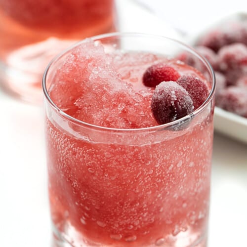 Glasses of Cranberry slush with Sugared Cranberries.
