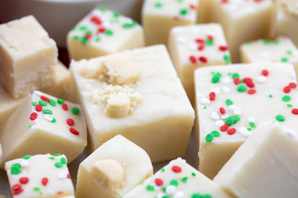 Sugar Cookie Fudge Pieces Stacked Together on a Christmas Dessert Charcuterie Board.