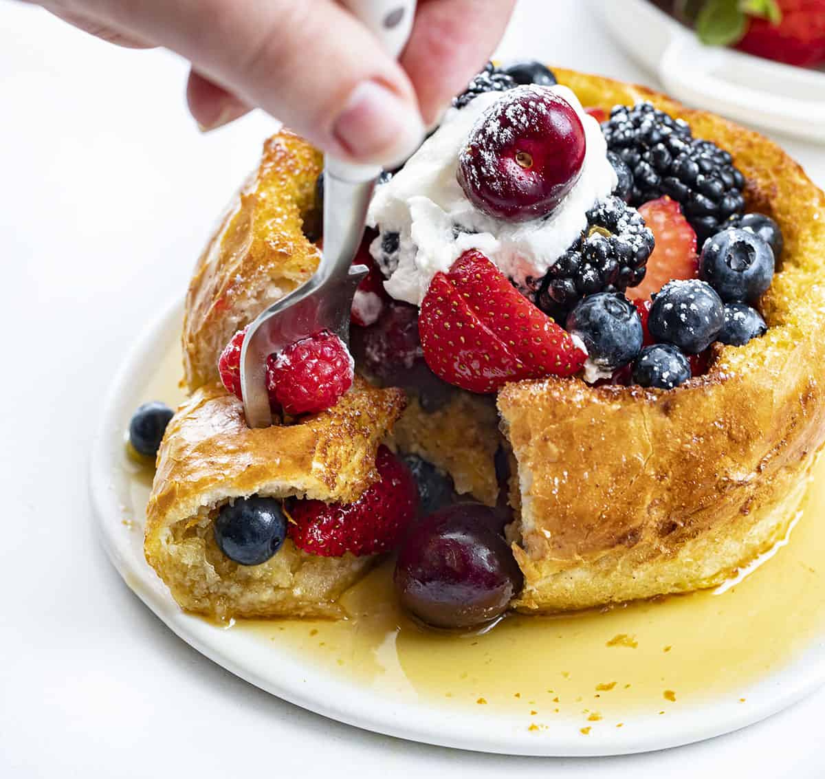 Taking a Bite from Fruit Filled French Toast Bread Bowl. reakfast, French Toast, French Toast Bread Bowl, Fresh Fruit French Toast Bread Bowl, How to Make a Bread Bowl into French Toast, What Bread for French Toast, Fruit Filled French Toast, Fruit Breakfast, Breakfast Recipes, Decadent Breakfast, Brunch Breakfast Ideas, i am baker, iambaker.