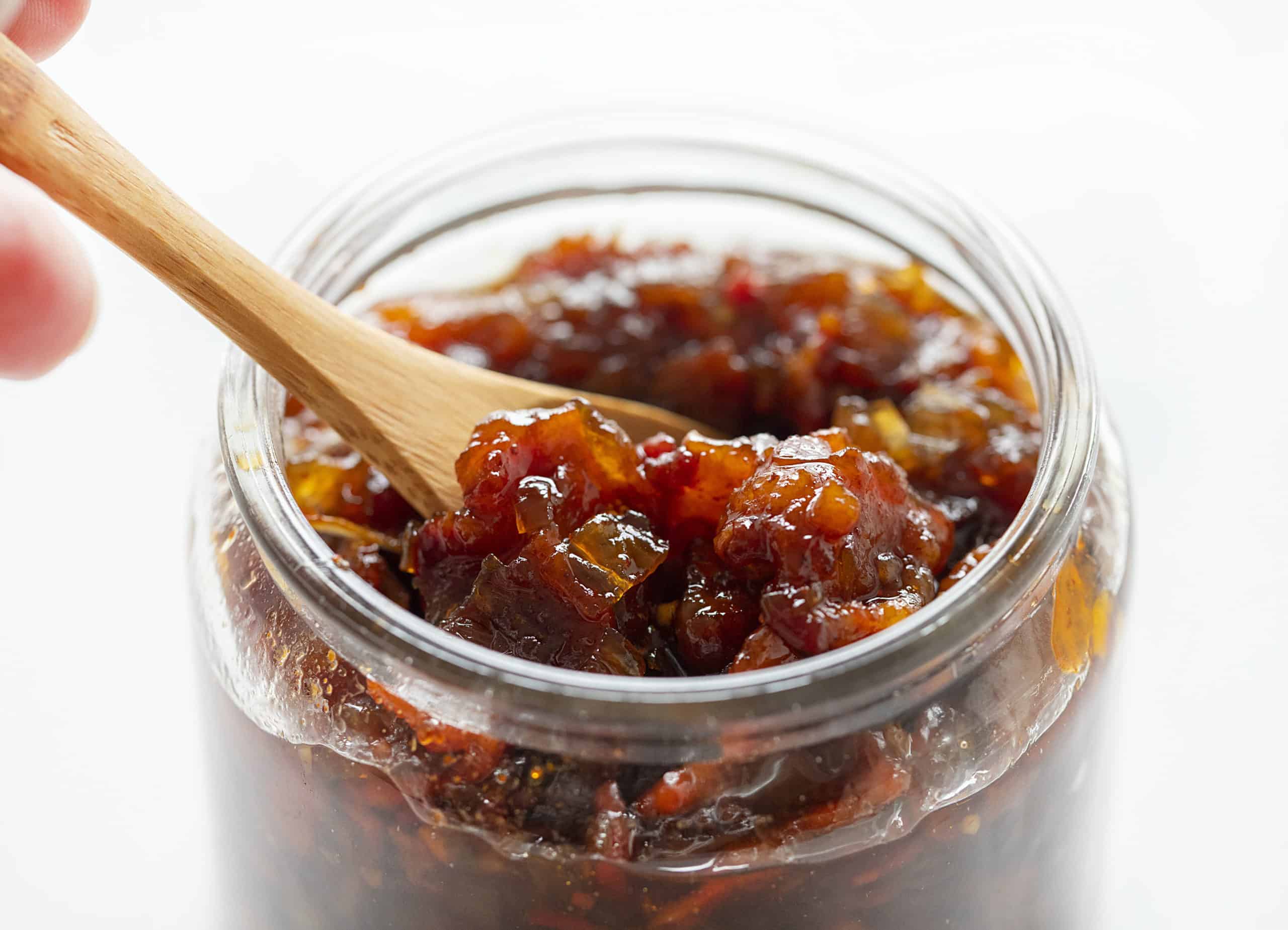 Onion Bacon Jam in a Jar with a Spoon