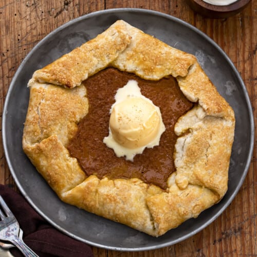 One Pumpkin Galette on a Plate with Ice Cream. Dessert, Thanksgiving, Pumpkin Pie Galette, Easy Pumpkin Dessert, How to Make Pumpkin Galette, Holiday Desserts, Easy Dessert, Pie Crust, Galette, i am baker, iambaker