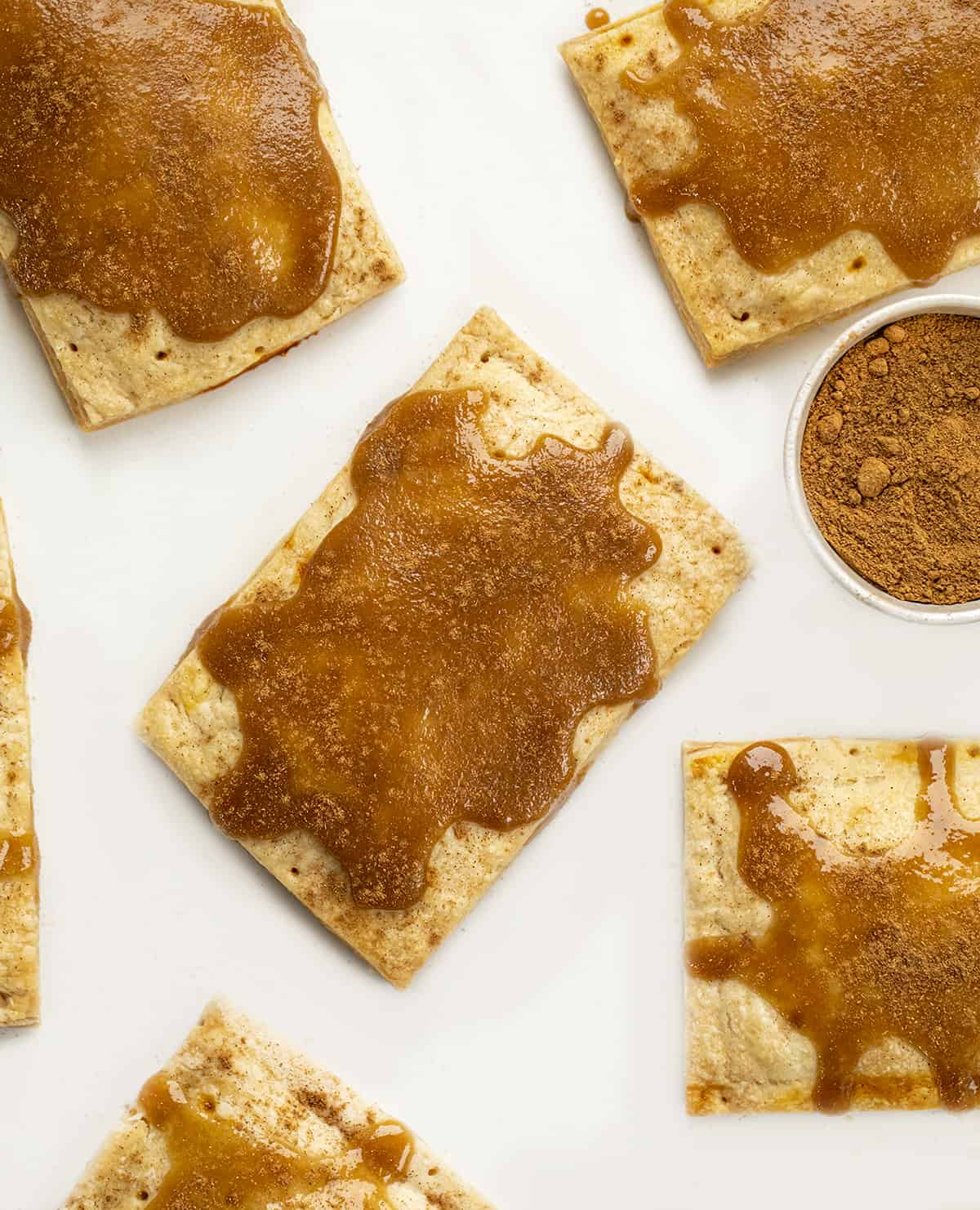 Pumpkin Pie Pop Tarts from Overhead Showing Glaze and Pumpkin Pie Spice. Breakfast, Pumpkin Dessert, Pumpkin Recipes, Baking, How to Make Pop Tarts, Breakfast Recipe Ideas, Dessert, Snacks, Treats, Fall Treats, Fall Baking Recipes, i am baker, iambaker