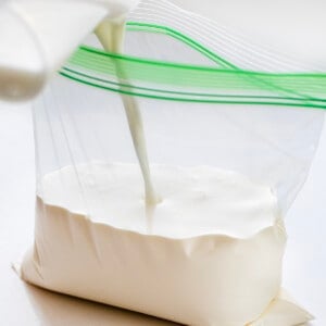 Adding Milk and Heavy Cream to a Plastic Bag to Make Soft Serve Ice Cream.