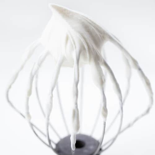 Whisk attachment with Stabilized Whipped Cream on it.