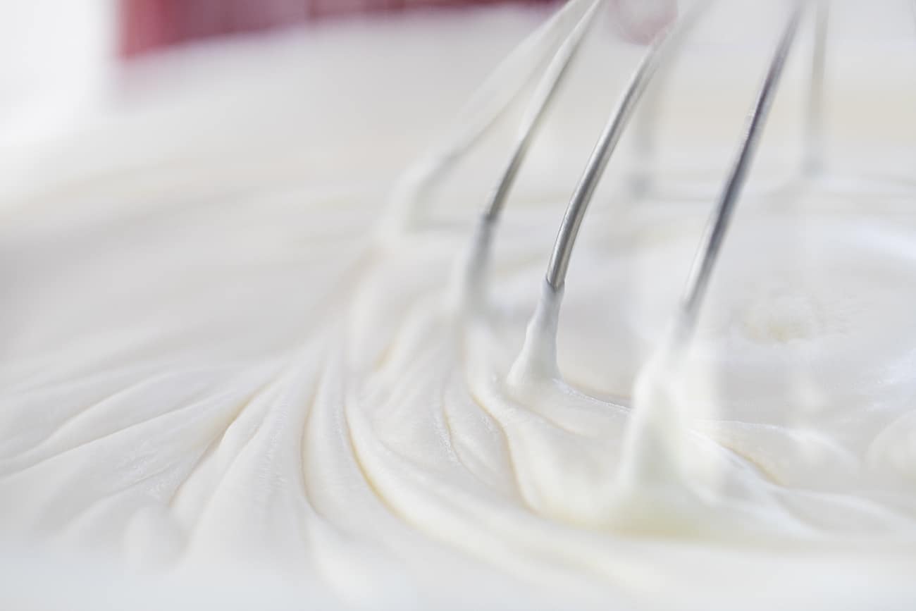 Stand Mixer Whipping Homemade Whipped Cream Causing Smooth Ripples