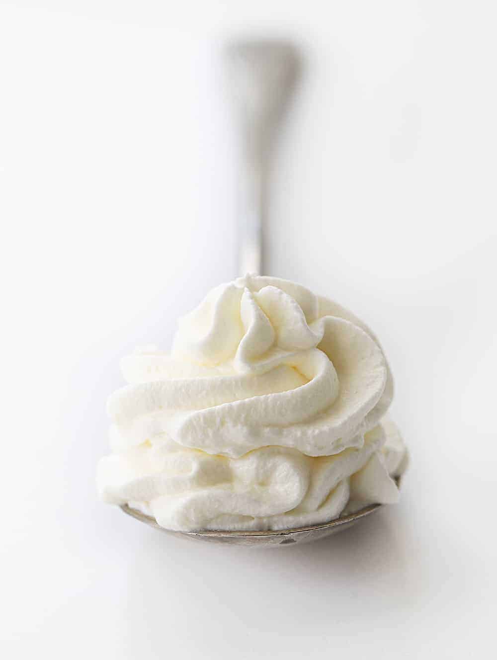 Spoon with Dollop of Homemade Whipped Cream Piped onto It